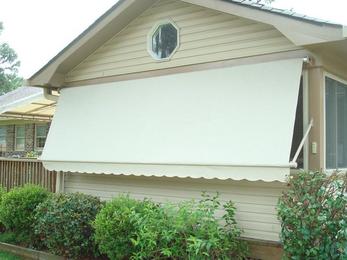 Retractable window awning